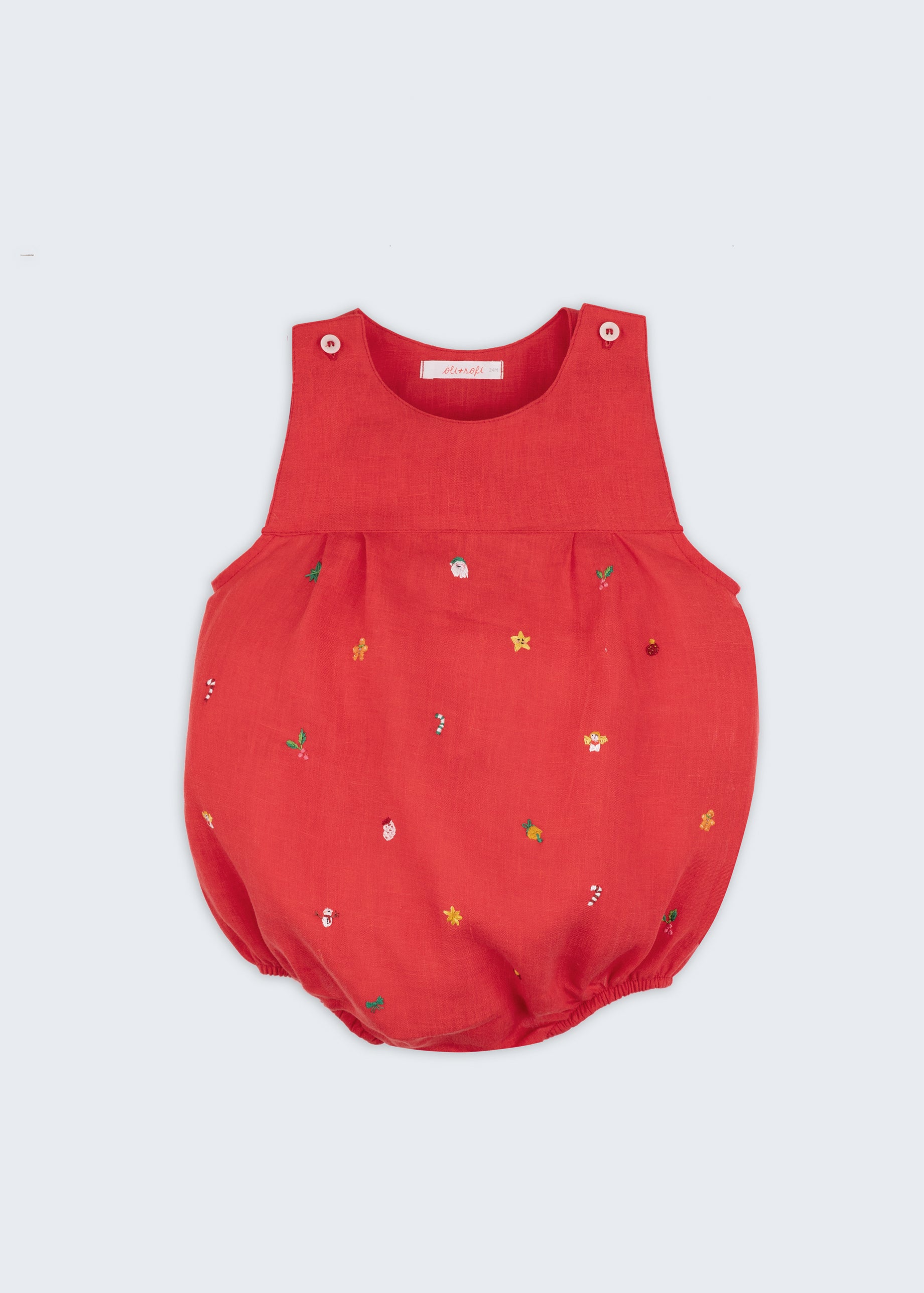 Macaquinho de bebê em linho vermelho com bordado natalino à mão de estrelas, anjinhos, Papai Noel e bengalas de hortelã.