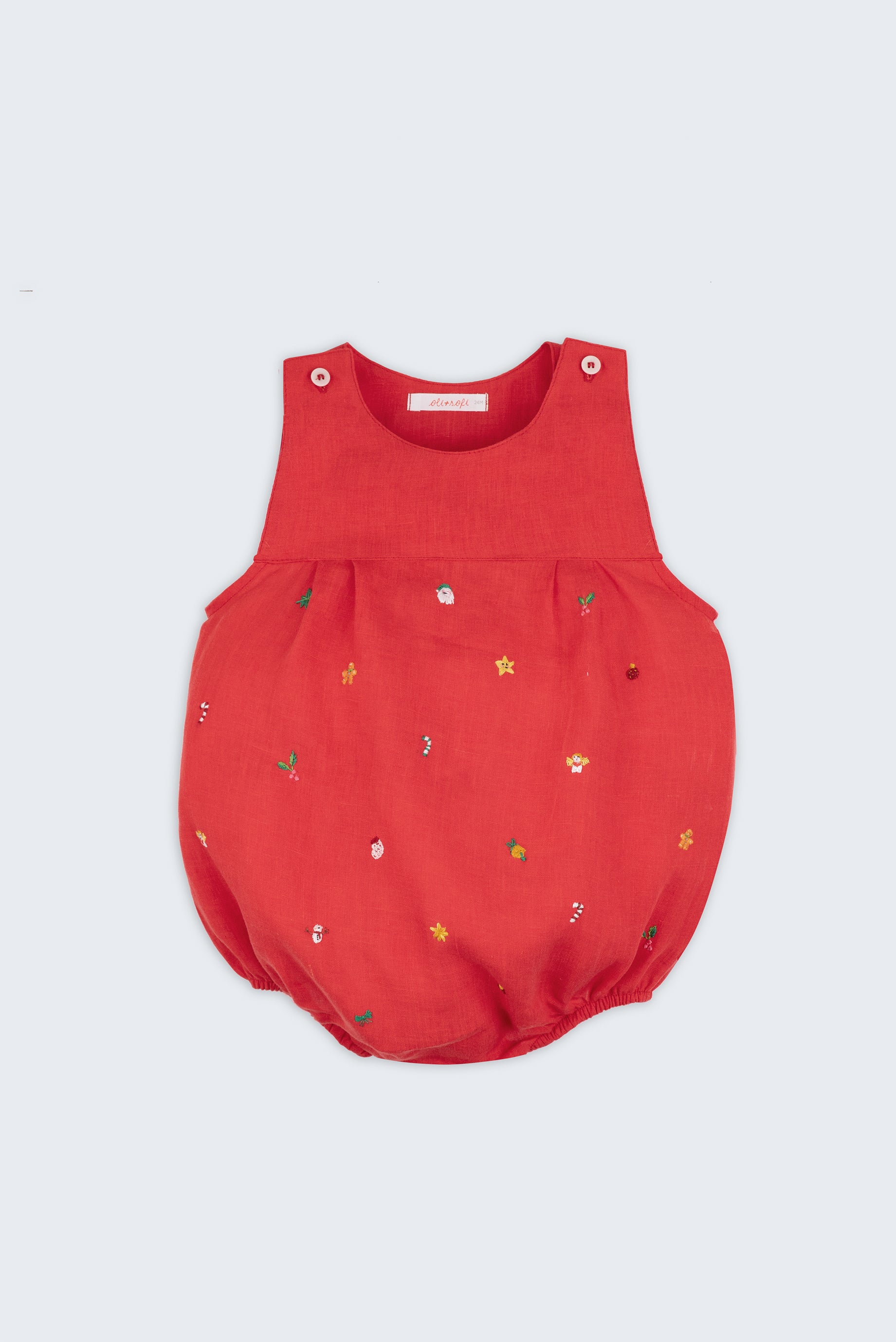 Macaquinho de bebê em linho vermelho com bordado natalino à mão de estrelas, anjinhos, Papai Noel e bengalas de hortelã.