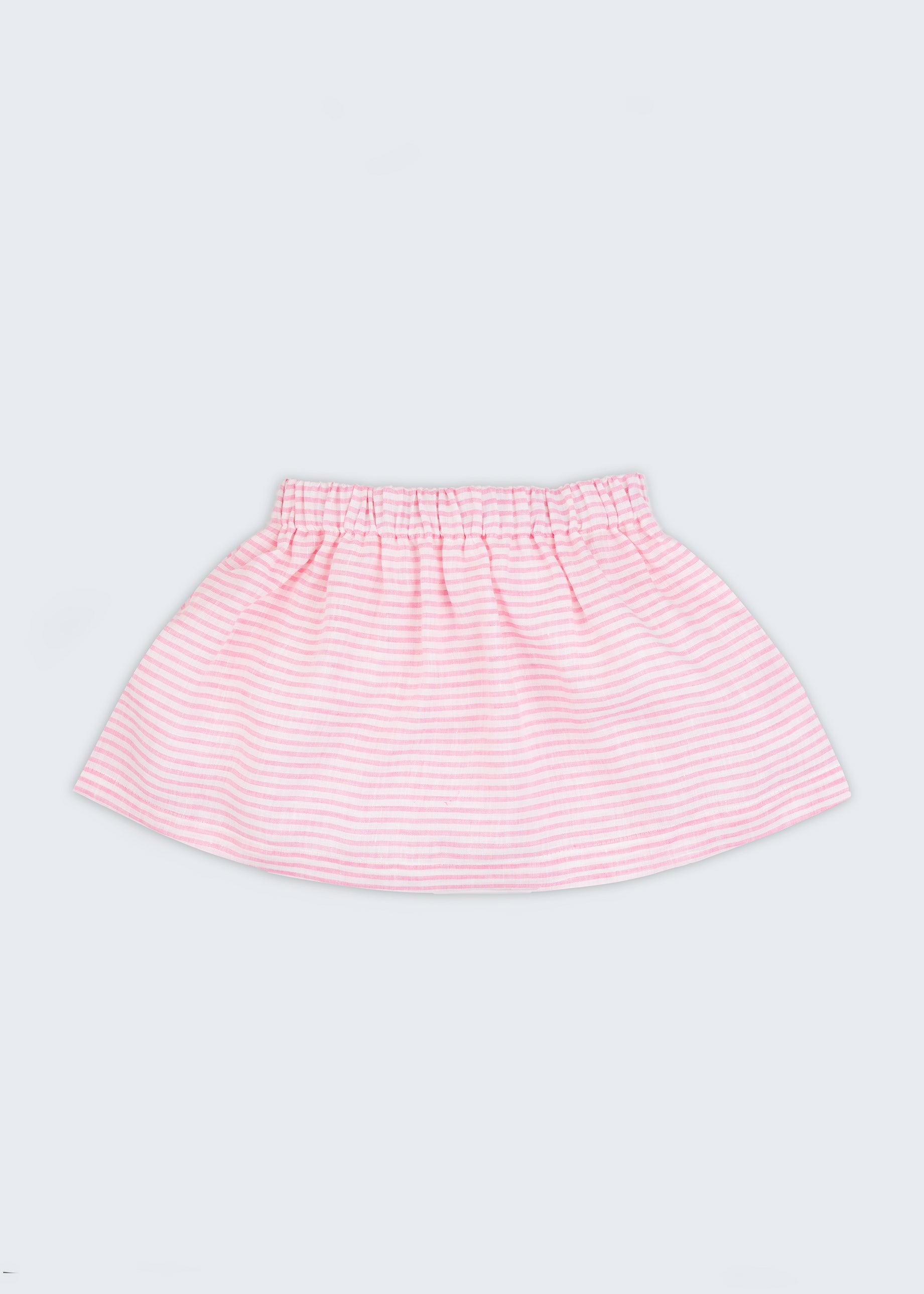 Saia infantil em linho listrado rosa e branco com elástico na cintura para meninas, vista de frente sobre fundo neutro.