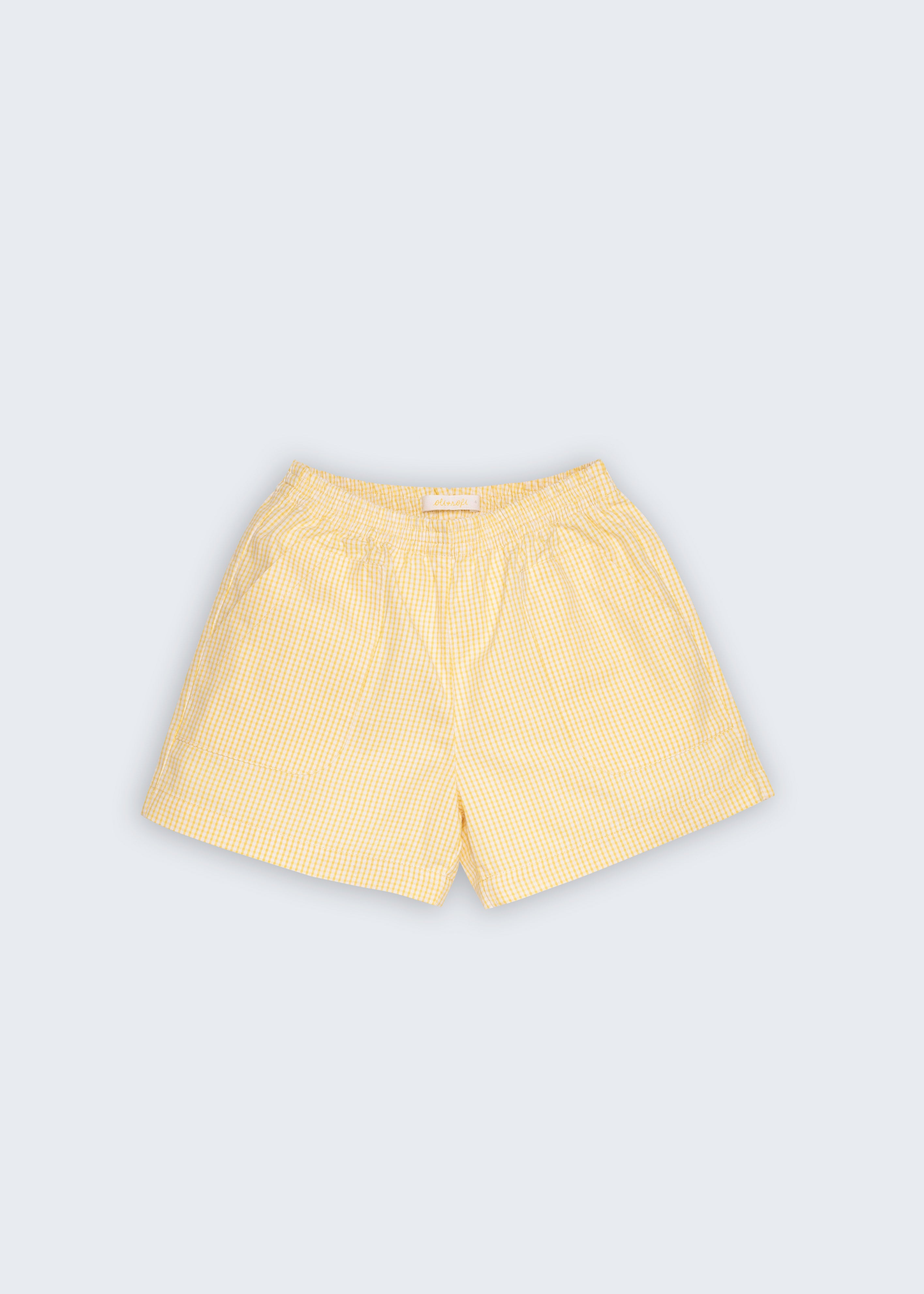 Shorts Chico infantil em anarruga 100% algodão com xadrez miúdo amarelo e branco, fotografado de frente.