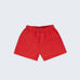 Shorts infantil em linho puro vermelho com bolsos frontais e cintura elástica para meninos e meninas, visto de frente.