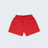 Shorts infantil em linho puro vermelho com bolsos frontais e cintura elástica para meninos e meninas, visto de frente.