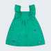 Vestido infantil em linho verde-água com bordado à mão de conchas e estrelas do mar, visto de frente 